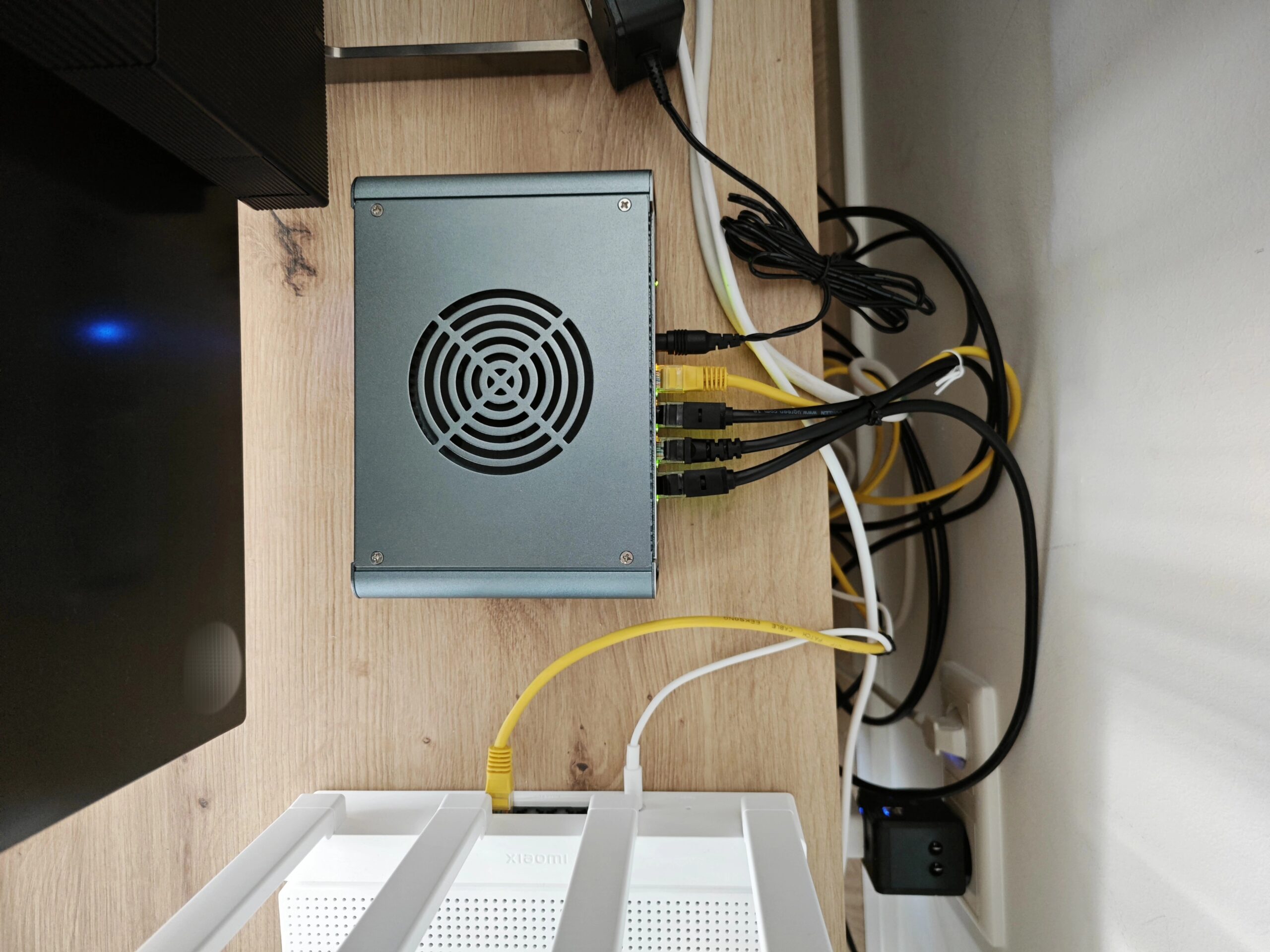 Top view of the home server, next to one of the Xiaomi routers/AP